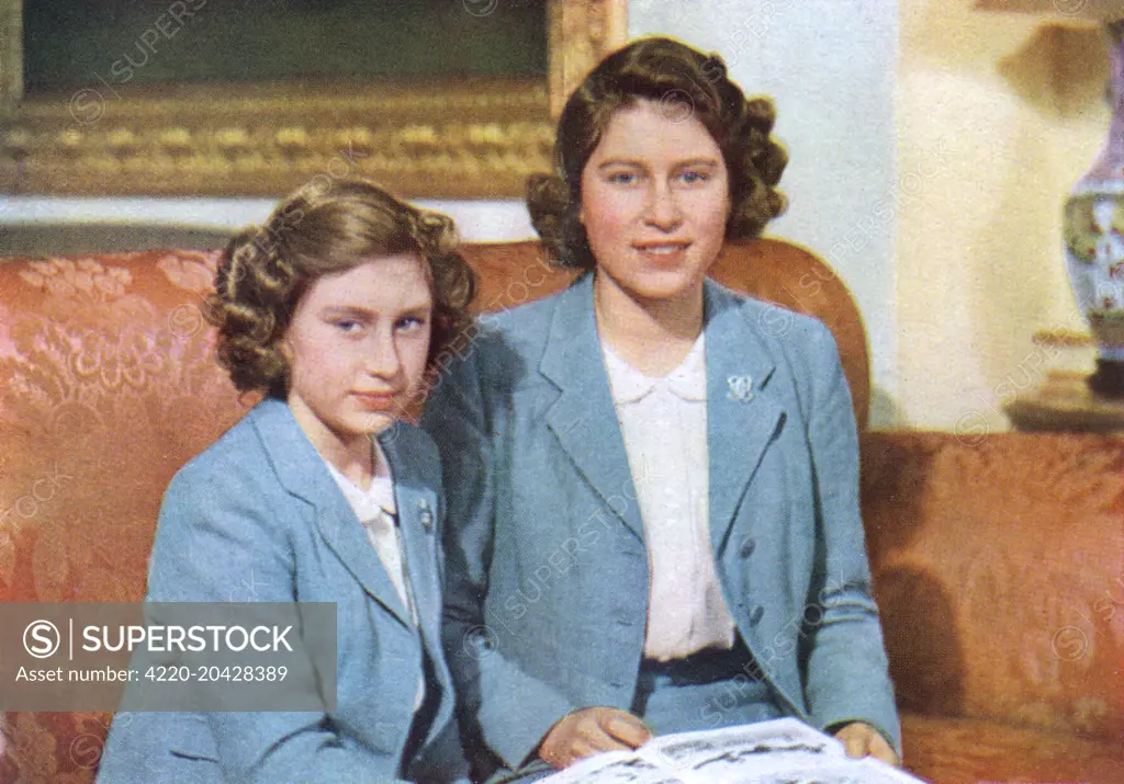Princess Elizabeth, later Queen Elizabeth II (1926 - ) and her younger sister Princess Margaret Rose (1930 - 2002) pictured together.  An exclusive photographic sitting of the royal family specially granted to the Illustrated London News to mark their centenary at that time.       Date: 1942