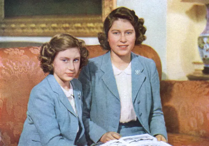 Princess Elizabeth, later Queen Elizabeth II (1926 - ) and her younger sister Princess Margaret Rose (1930 - 2002) pictured together.  An exclusive photographic sitting of the royal family specially granted to the Illustrated London News to mark their centenary at that time.       Date: 1942