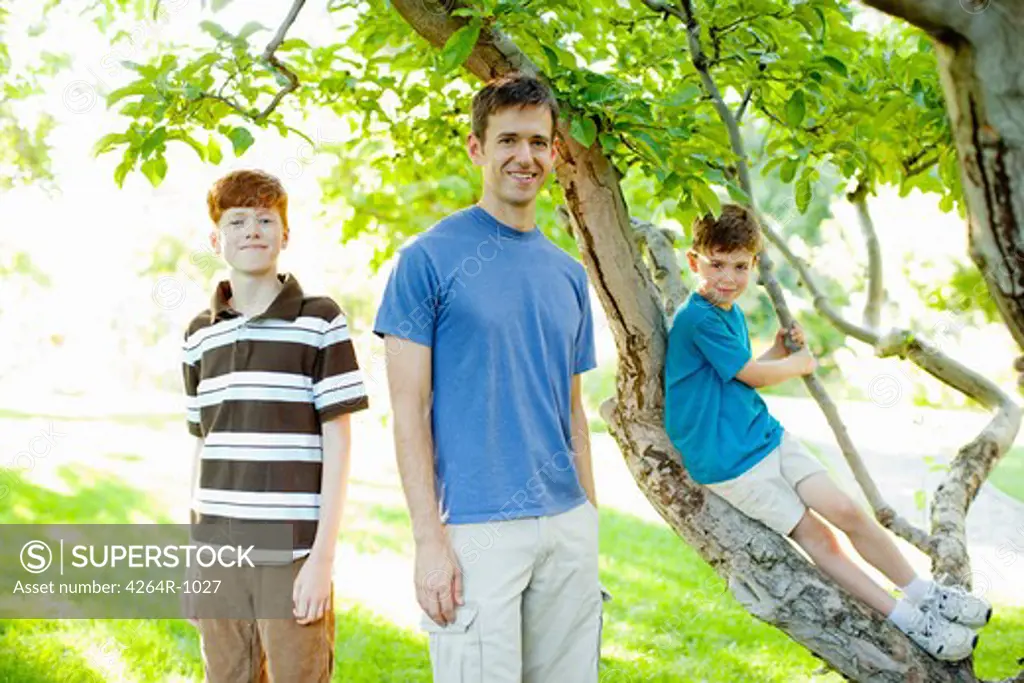 Father and sons in garden