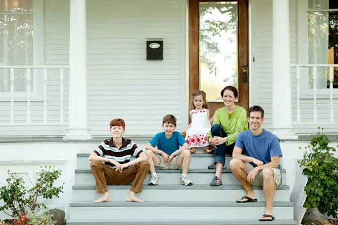 Parents with kids sitting on porch