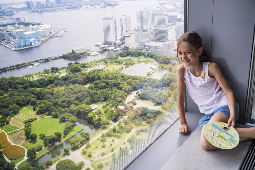 8 year old girl looking at Tokyo Bay, Japan.