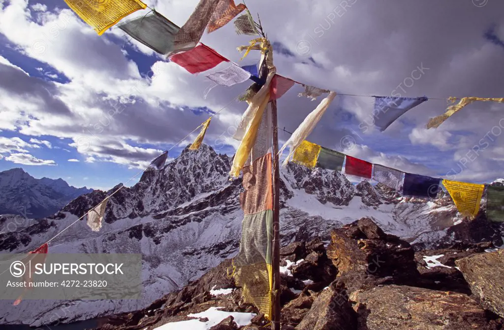 Prayer flags on top of Gokyo Rei looking northwards towards the Tibet  border - SuperStock