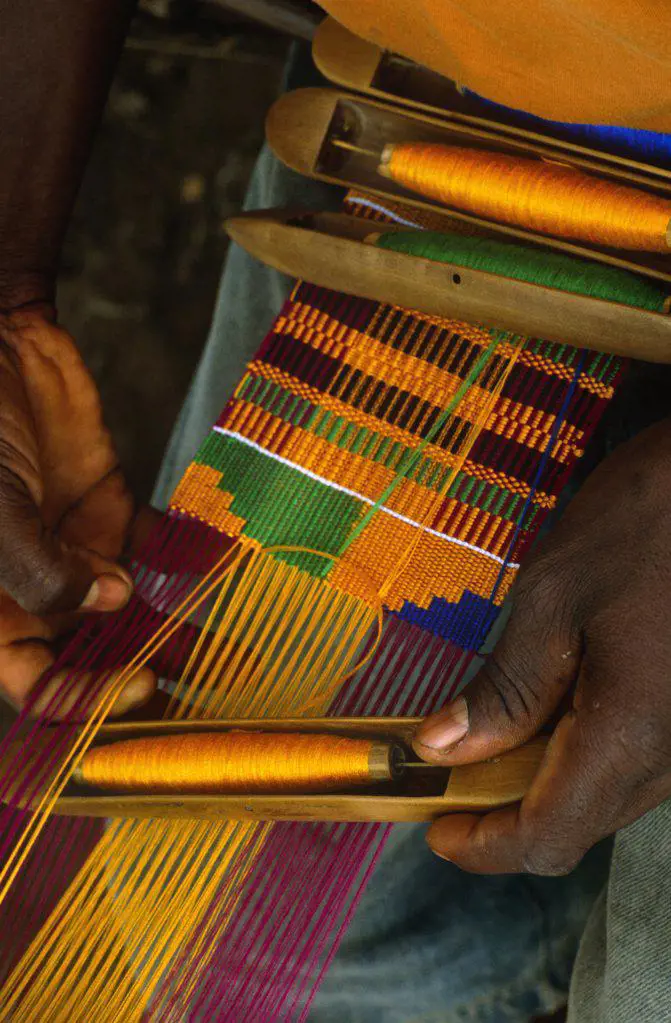 Ghana, Volta region, Tafi Abuipe. Fine Kente cloth being woven. The Ashantis and Ewes both lay claim to having invented it.