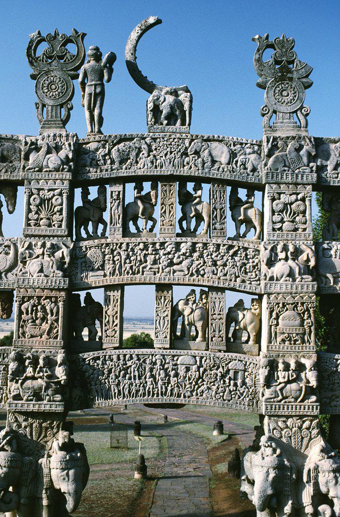 Four elaborate toranas, or gateways, guard the Great Stupa, India's finest surviving Buddhist monument begun by the Emperor Ashoka in the third century BC. Despite a fragmented wheel of life, this northern torana is the best preserved and depicts scenes from the Buddha's life.