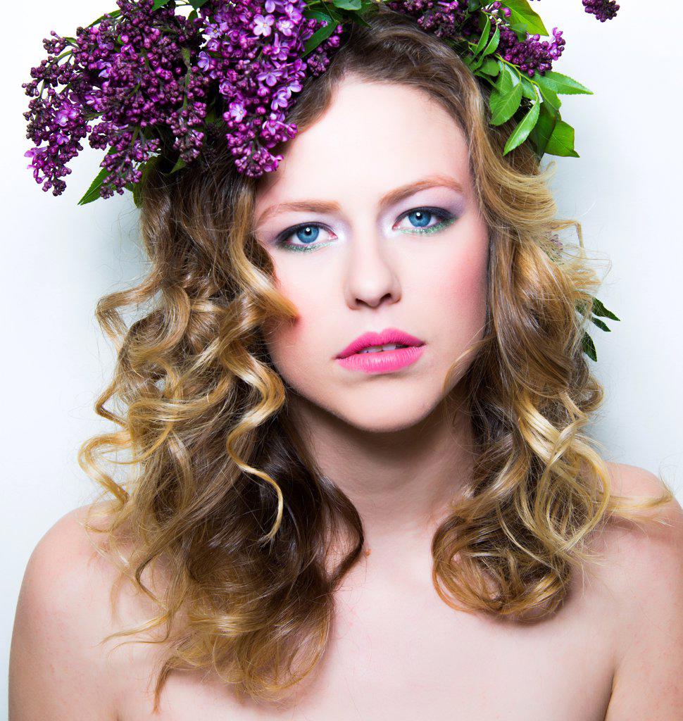 Young Woman with Purple Flowers on Head