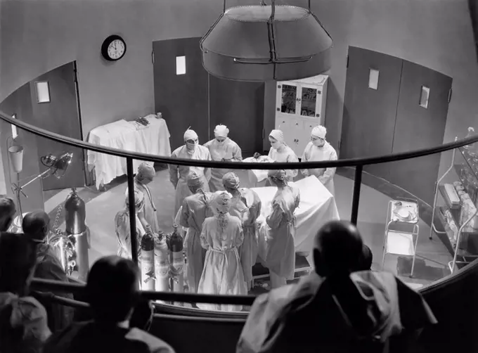 View of operating theater with spectators All persons depicted are not longer living and no estate exists Supplier warranties that there will be no mo...