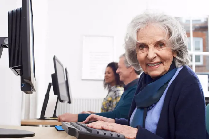 Senior Woman Attending Computer Class