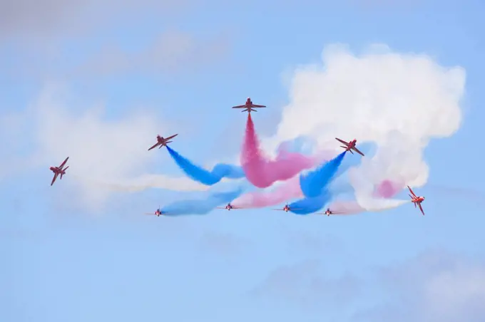 England, Gloucestershire, Fairford. The Red Arrows team breaking from formation at the Royal International Air Tattoo at RAF Fairford 2011.
