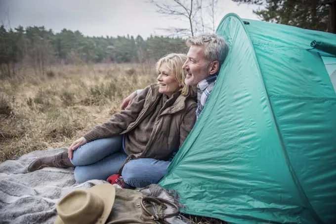 Senior couple enjoying the wilderness from their campsite.
