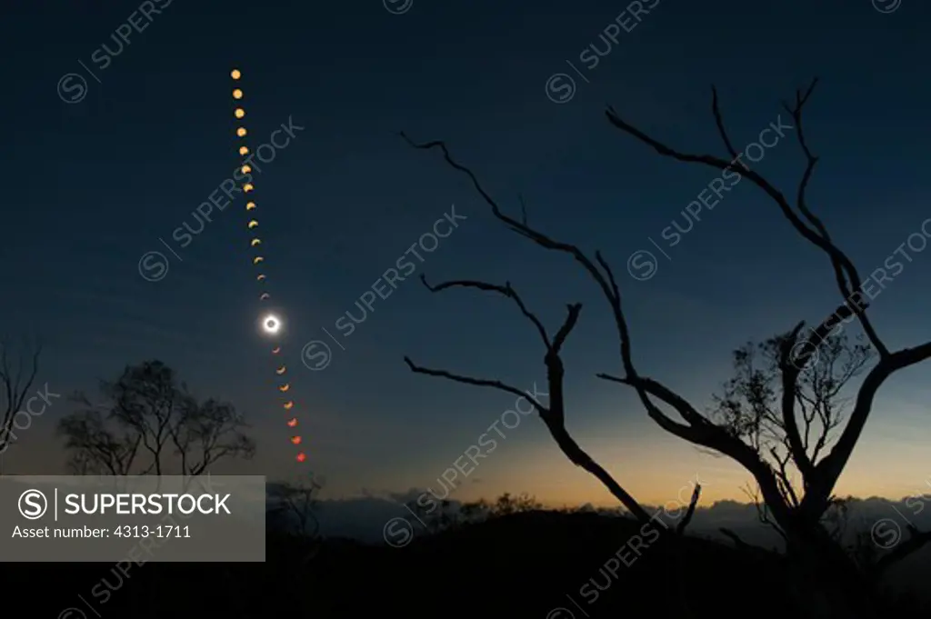 Australia, Queensland, view of total solar eclipse. A multiple exposure captures the phases of the Total Solar Eclipse of November 14, 2012 over outback Queensland, Australia.