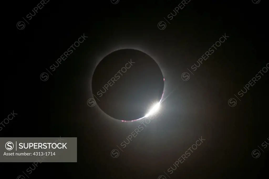 Australia, Queensland, view of total solar eclipse with diamond-ring effect. The diamond-ring effect is seen as a tiny sliver of sunlight peeks from behind the moon during the November 14, 2012