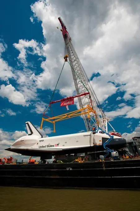Space Shuttle prototype Enterprise is lifted onto the deck of the USS Intrepid Sea, Air & Space Museum on New York City's Hudson River. Intrepid becomes the shuttle's new home after a decade on display at the Smithsonian National Air & Space Museum