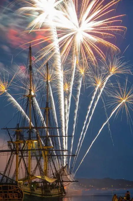 USA, Massachusetts, Salem, Fireworks exploding over replica tall-mast ship