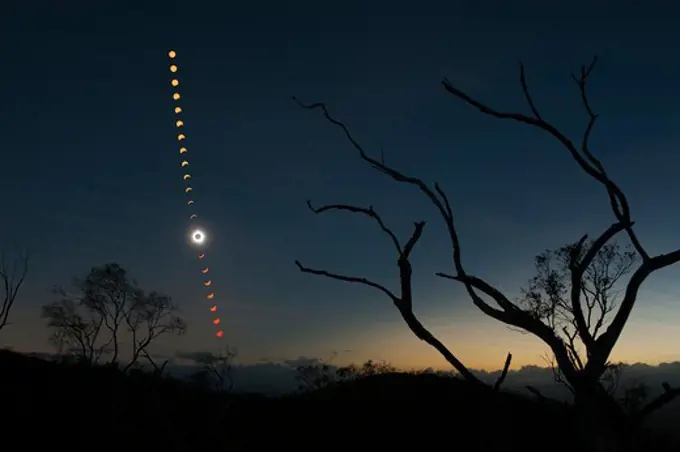 Australia, Queensland, view of total solar eclipse. A multiple exposure captures the phases of the Total Solar Eclipse of November 14, 2012 over outback Queensland, Australia.