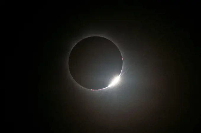 Australia, Queensland, view of total solar eclipse with diamond-ring effect. The diamond-ring effect is seen as a tiny sliver of sunlight peeks from behind the moon during the November 14, 2012