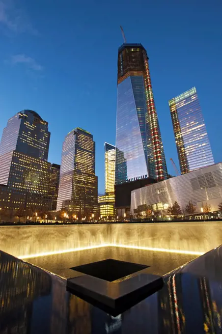 National September 11 Memorial and new World Trace Center at twilight.