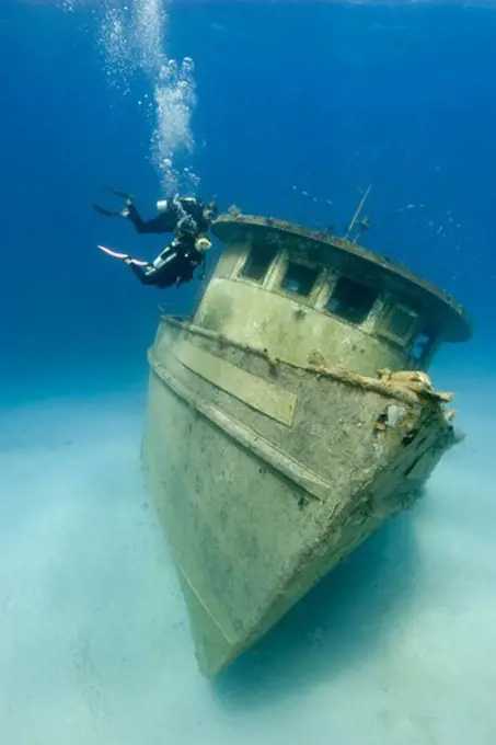 A Pair of Scuba Divers Approach the Captain Fox Tugboat Wreck