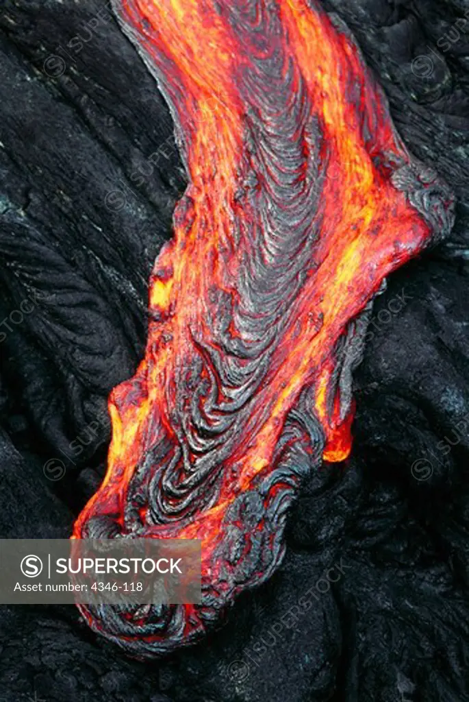 A Stream of Glowing Hot Pahoehoe Lava Oozing Over a Ledge