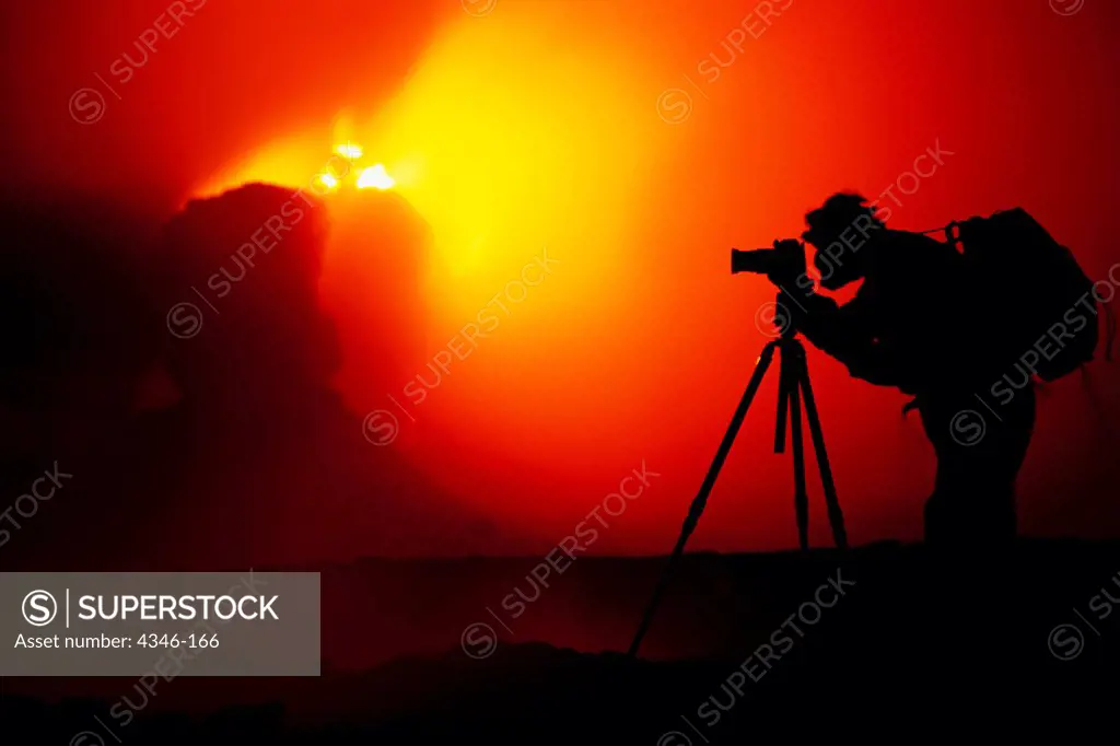 Photographer Silhouetted by Erupting Spatter Cones within Pu'u O'o Vent