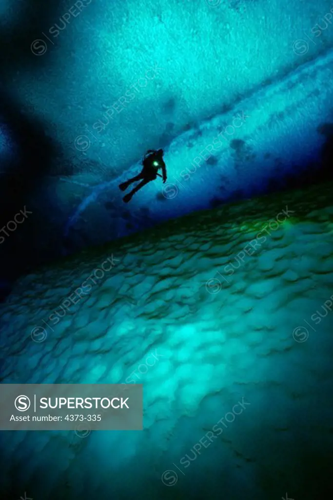 Diver Over Grounded Iceberg