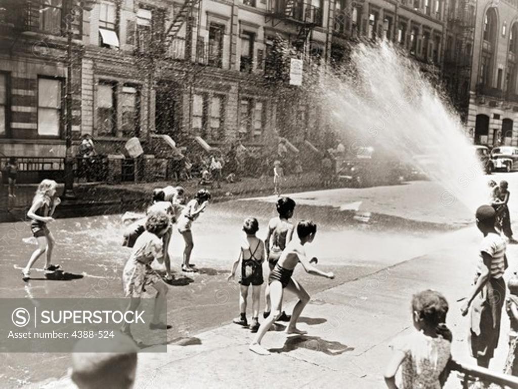 Stock Photo: 4388-524 Playing in the Fire Hydrant Spray