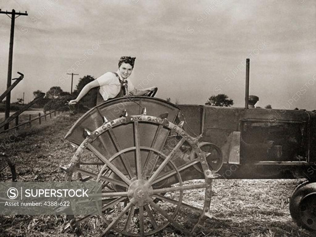 Stock Photo: 4388-622 Woman with Tractor
