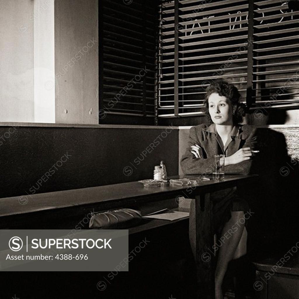 Stock Photo: 4388-696 Woman Sitting Alone