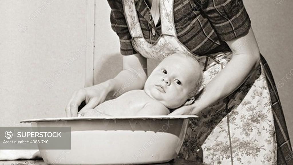Stock Photo: 4388-760 Bathing a Baby