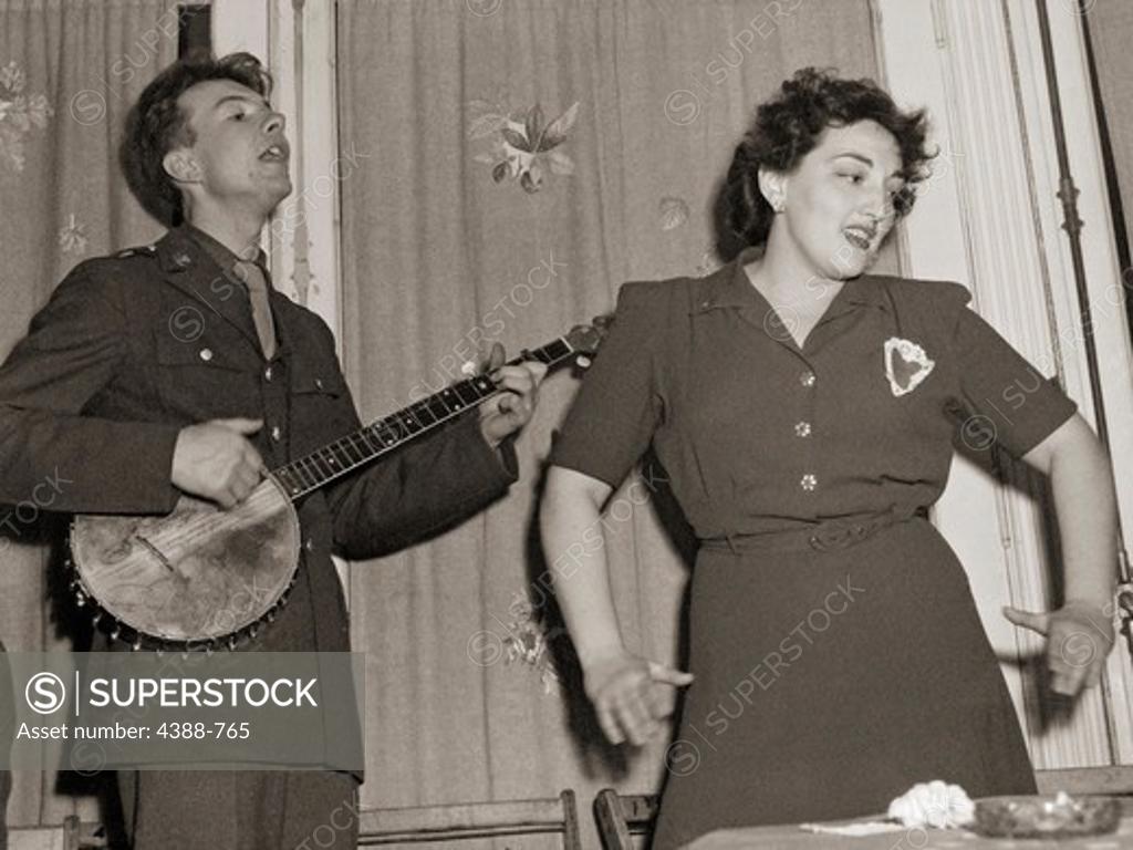 Stock Photo: 4388-765 Pete Seeger Playing at Canteen Opening