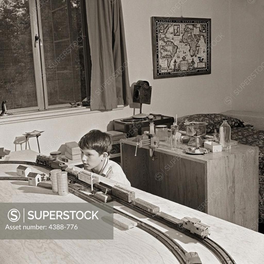 Stock Photo: 4388-776 Boy Playing with Train
