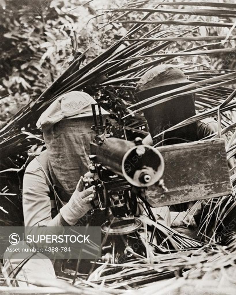 Stock Photo: 4388-784 Machine Gunner in Mosquito Netting