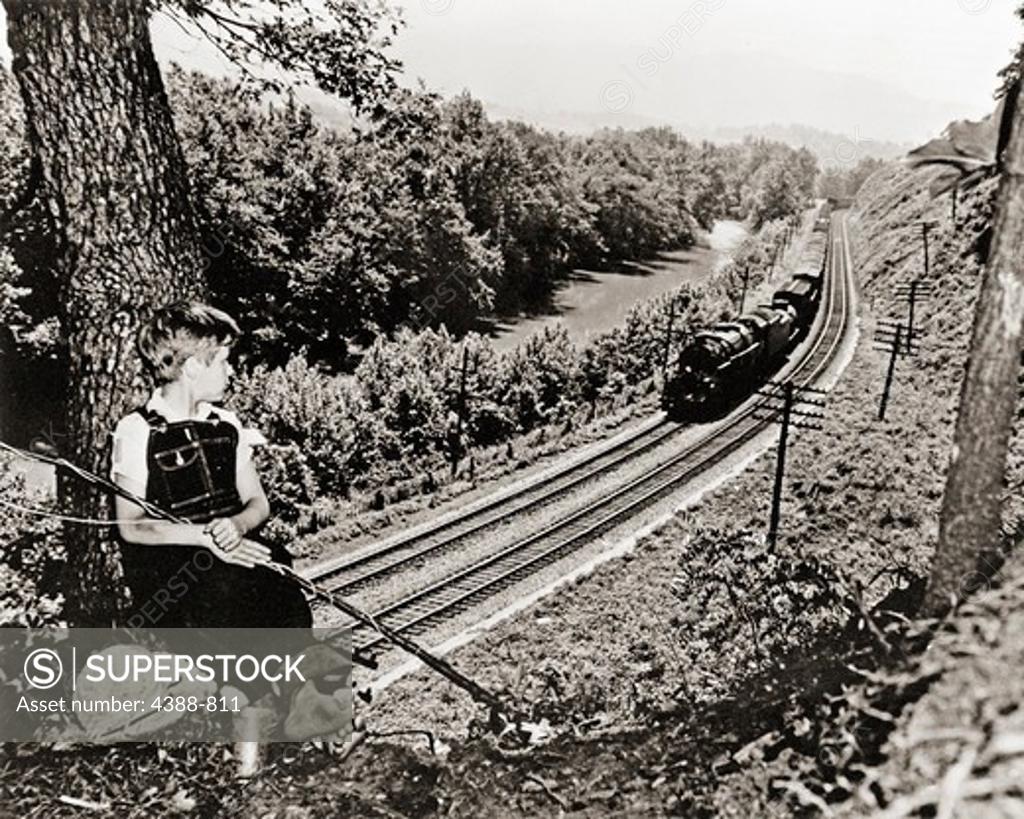 Stock Photo: 4388-811 Boy Watching Train