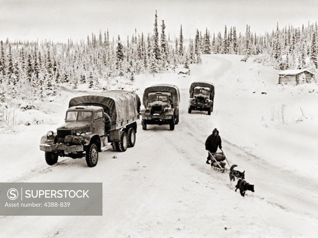 Stock Photo: 4388-839 Trucks and Dogsled on ALCAN