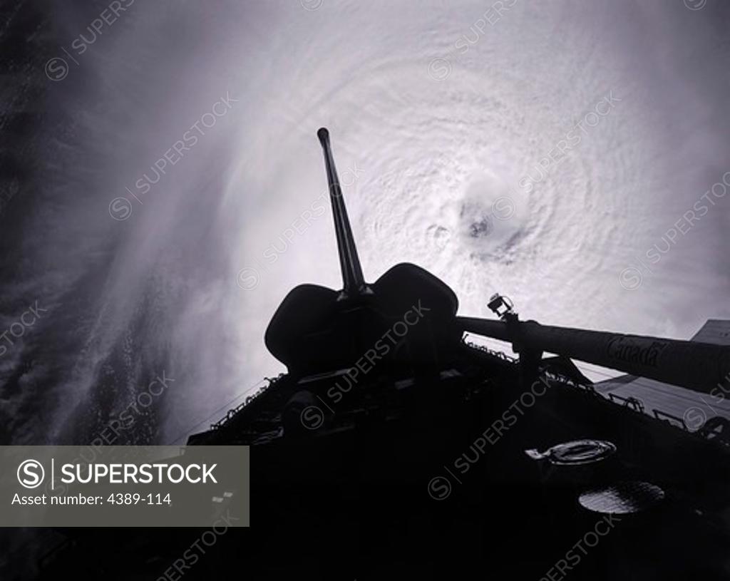 Stock Photo: 4389-114 View of a Cyclone Behind the Tail of Space Shuttle Columbia in Earth Orbit
