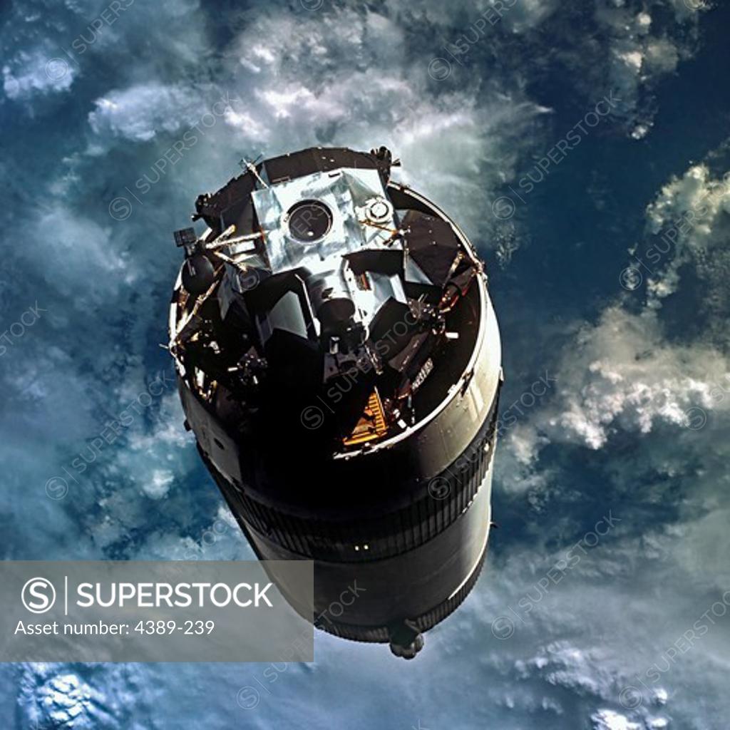 Stock Photo: 4389-239 Apollo 9 - The Final Stage of a Saturn V Above the Earth's Atmosphere