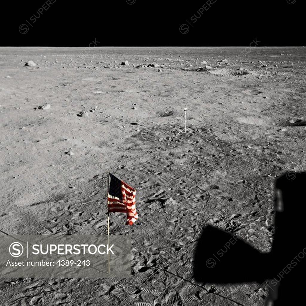 Stock Photo: 4389-243 Apollo 11 - An American Flag and Footprints on the Moon