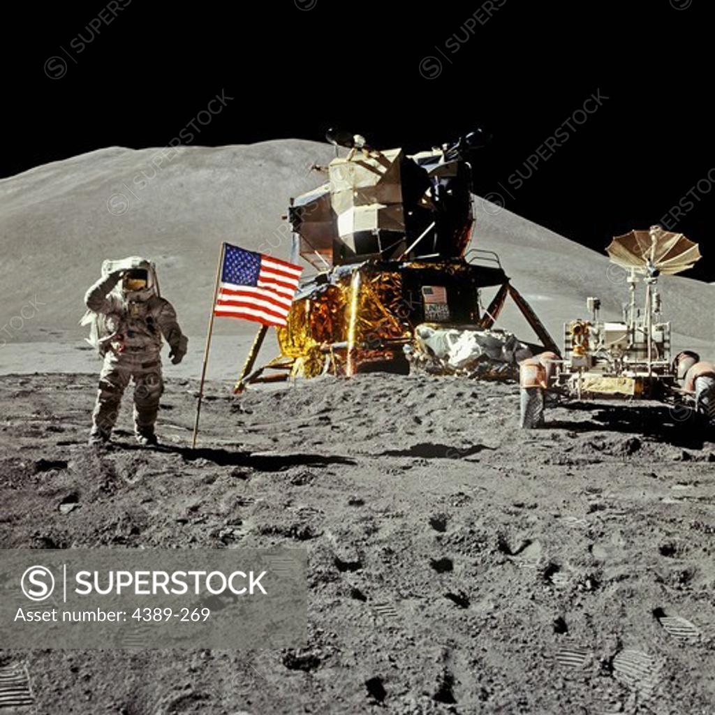 Stock Photo: 4389-269 Apollo 15 Astronaut Saluting on the Moon With the Lunar Lander Falcon and Rover
