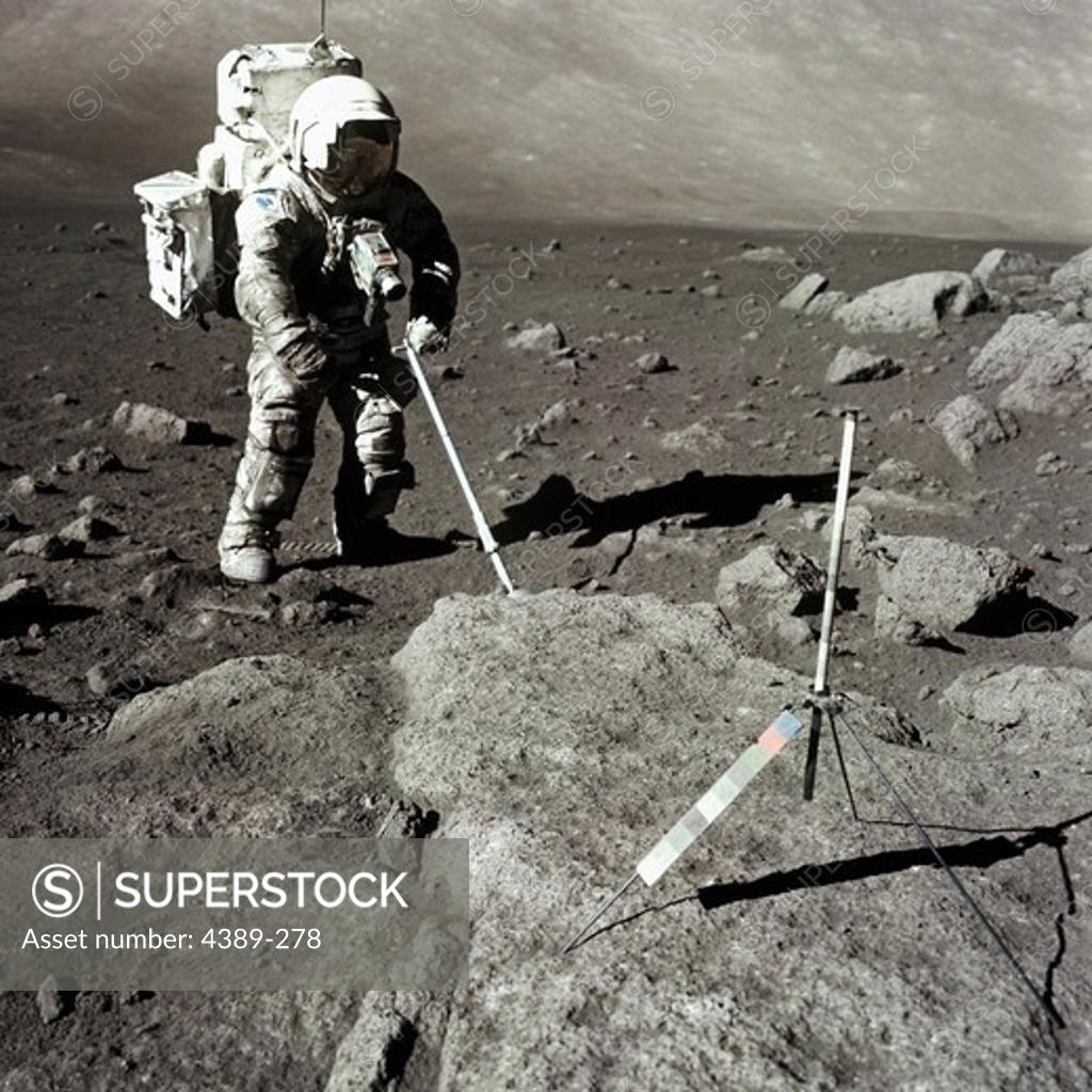 Stock Photo: 4389-278 Apollo 17 Astronaut Takes a Lunar Core Sample