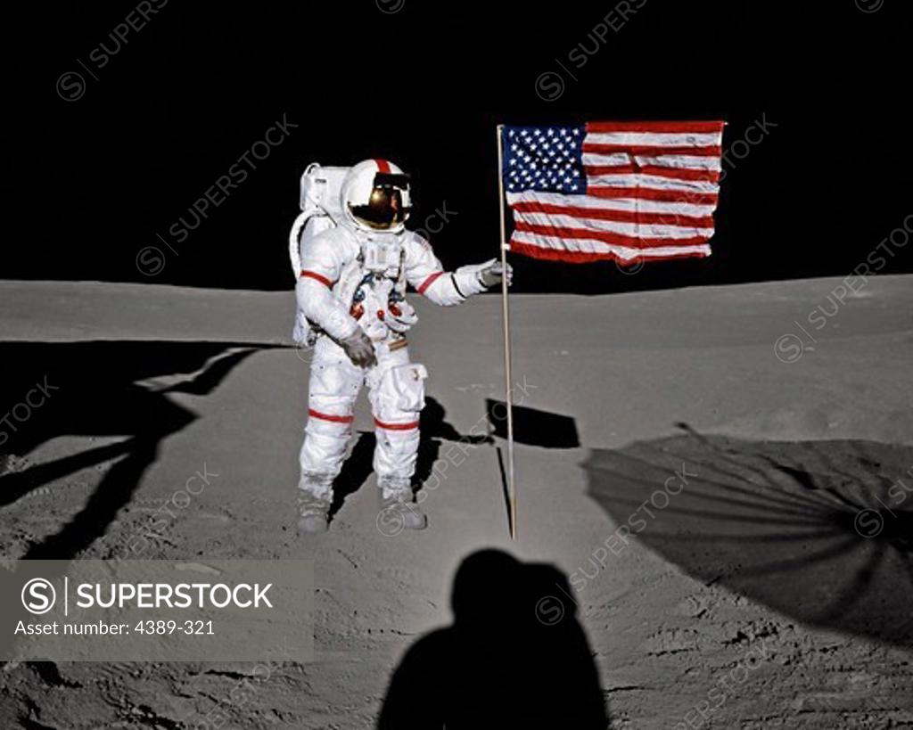 Stock Photo: 4389-321 Alan Shepard Poses with An American Flag During Apollo 14