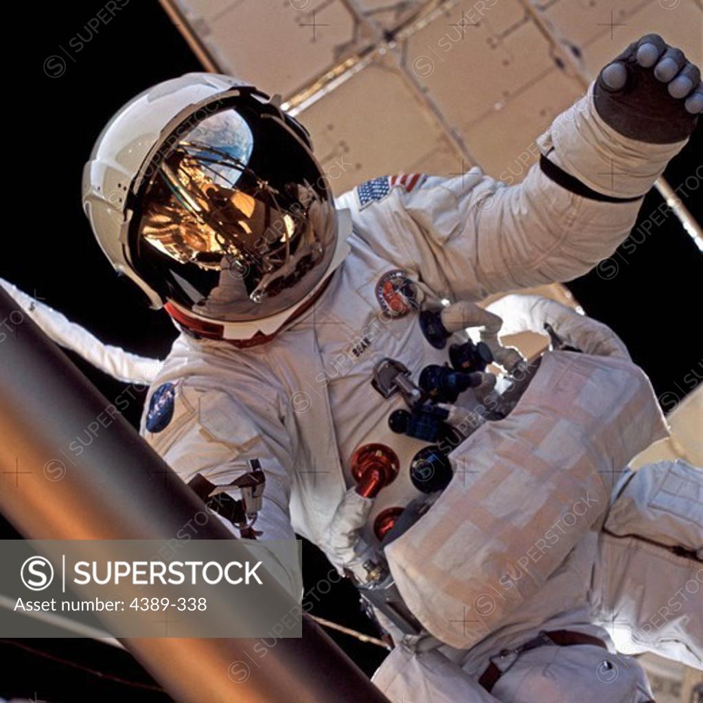 Stock Photo: 4389-338 Astronaut Performing a Spacewalk Outside Skylab