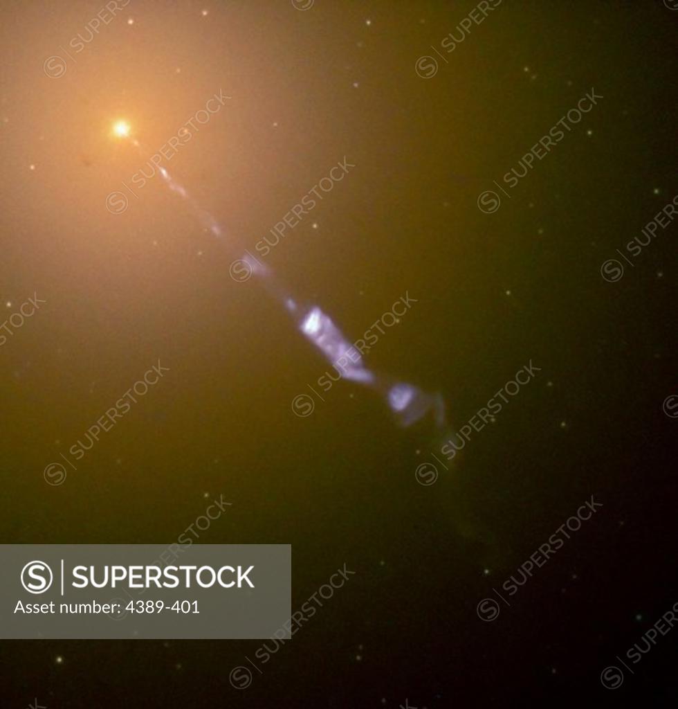 Stock Photo: 4389-401 An Elliptical Galaxy Resembles a Searchlight in the Night Sky
