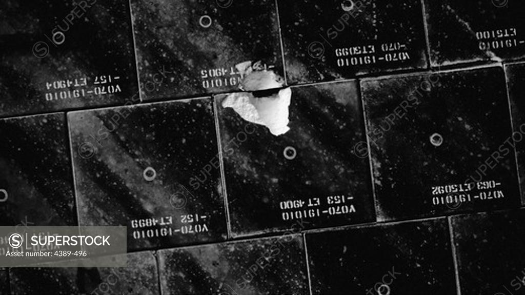 Stock Photo: 4389-496 Damaged Tile on Space Shuttle