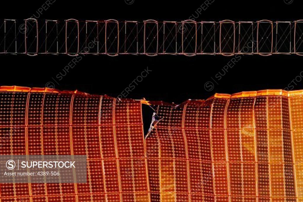 Stock Photo: 4389-506 Tear in Solar Array Wing