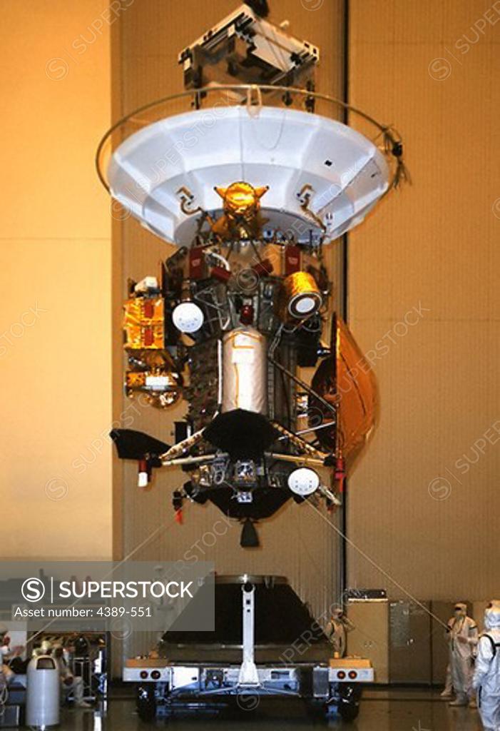 Stock Photo: 4389-551 Examining Cassini-Huygens Probe