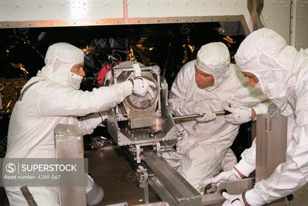 Stock Photo: 4389-567 Installing Power Supply on Cassini Probe