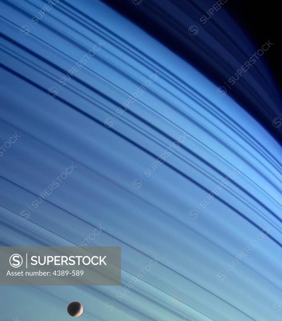 Stock Photo: 4389-589 Mimas and Ring Shadows Against Saturn