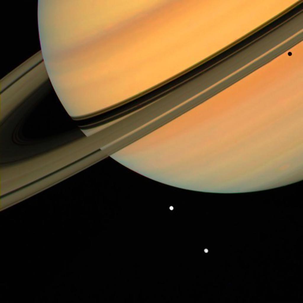 Saturn with Two Moons Tethys and Dione, From Voyager 1