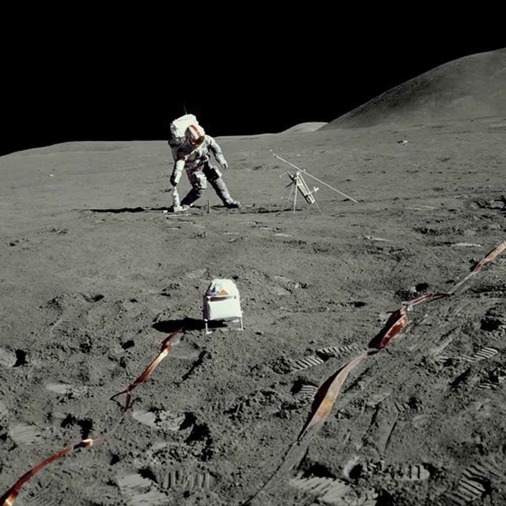 An Apollo 15 Astronaut Prepping Science Equipment on the Moon