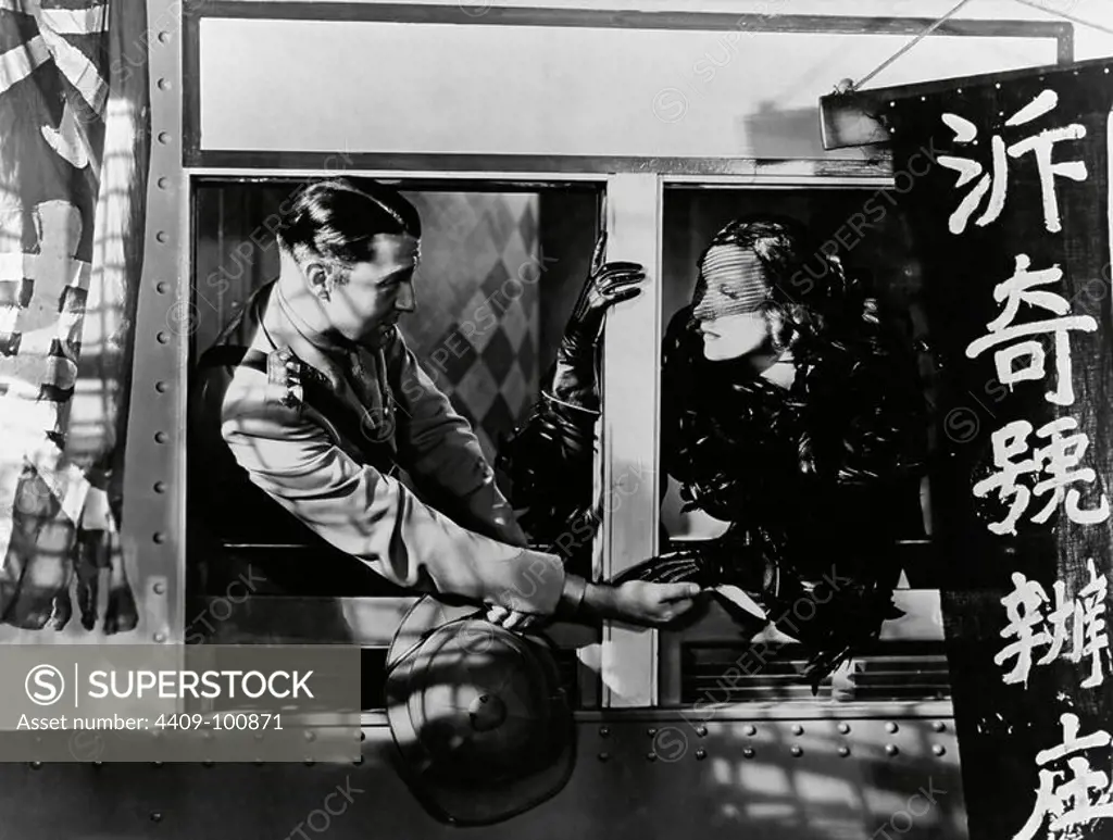 MARLENE DIETRICH and CLIVE BROOK in SHANGHAI EXPRESS (1932), directed by JOSEF VON STERNBERG.