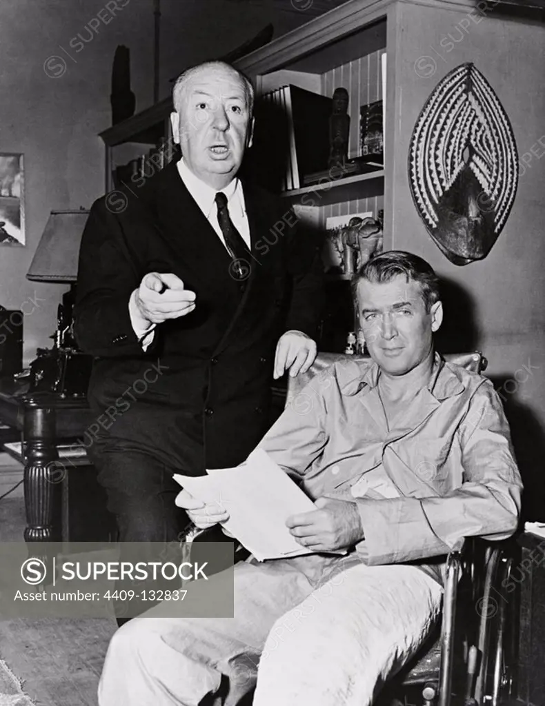 JAMES STEWART and ALFRED HITCHCOCK in REAR WINDOW (1954), directed by ALFRED HITCHCOCK.
